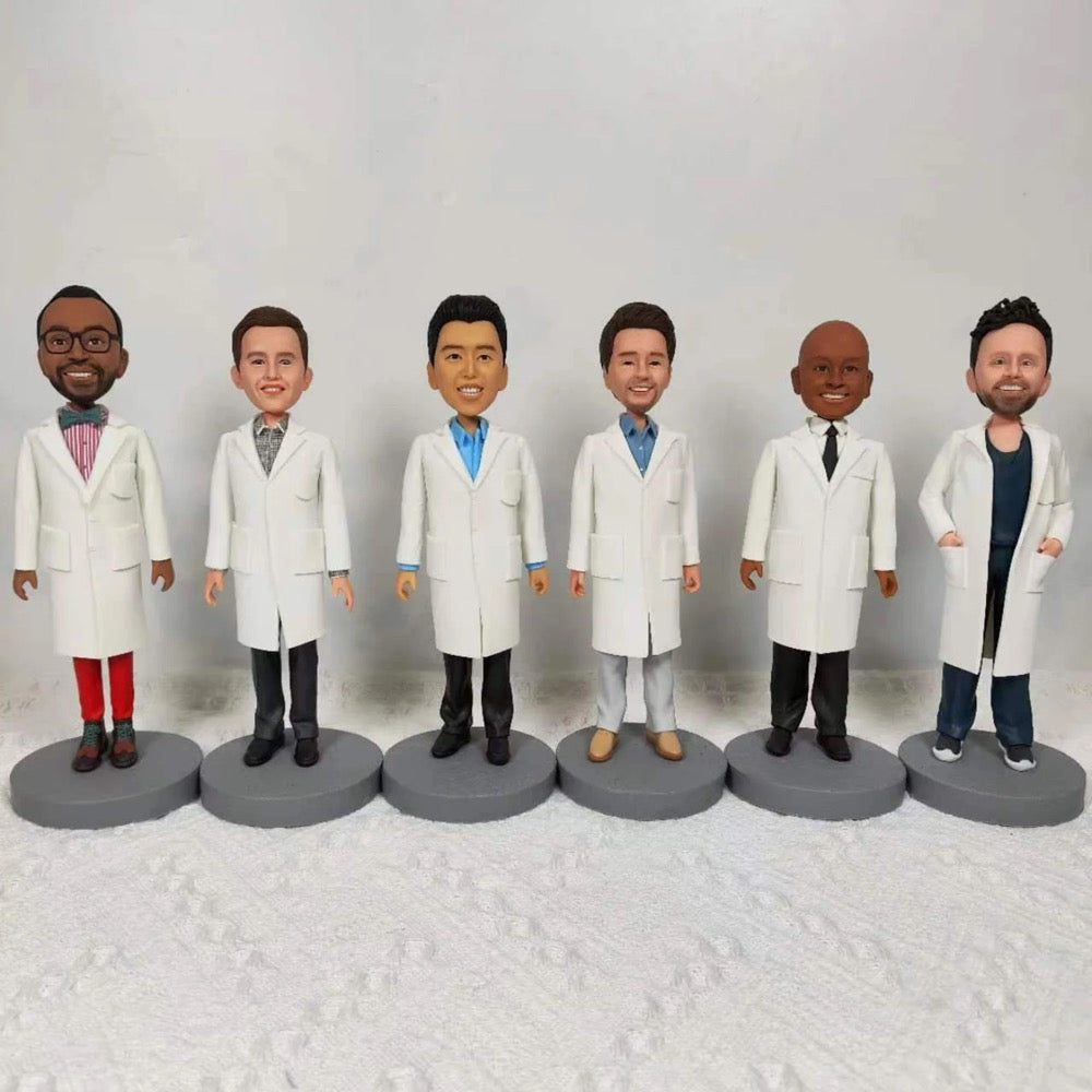 Group of custom doctor bobbleheads in white coats, personalized team figures for healthcare professionals.