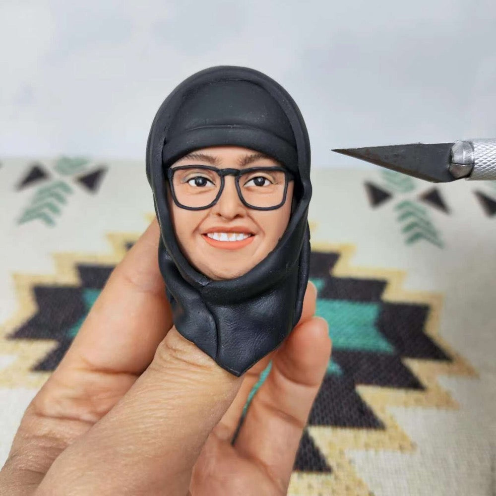 Handcrafted female doctor bobblehead doll with glasses and hijab, perfect for gifting and personalization.