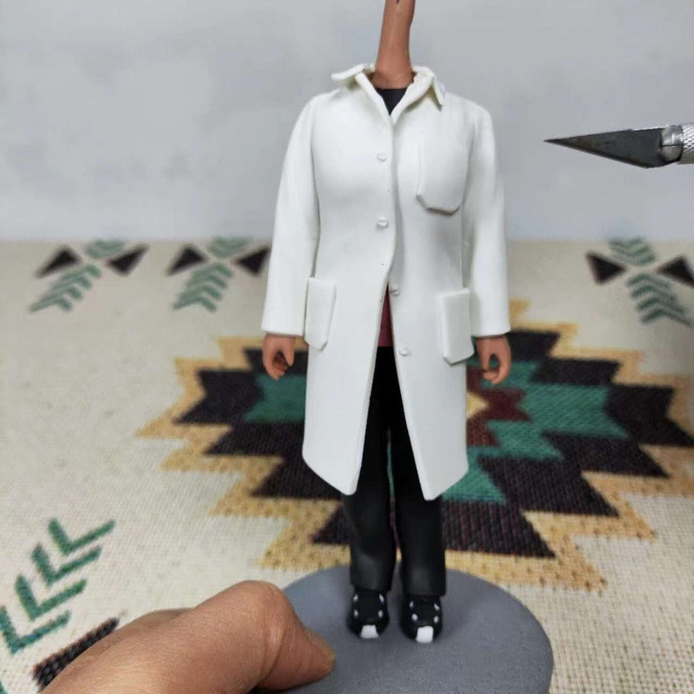 Handcrafted custom female doctor bobblehead figure in a white coat, ready for personalization. Unique gift idea.