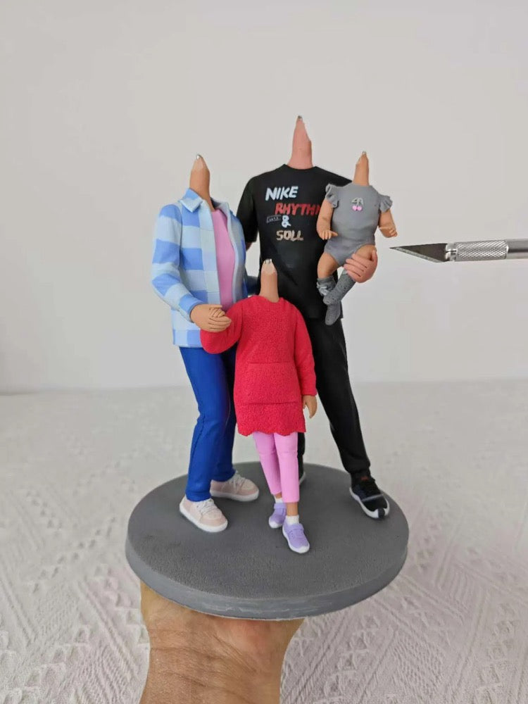 Custom cake topper with three figures on a stand against a neutral background