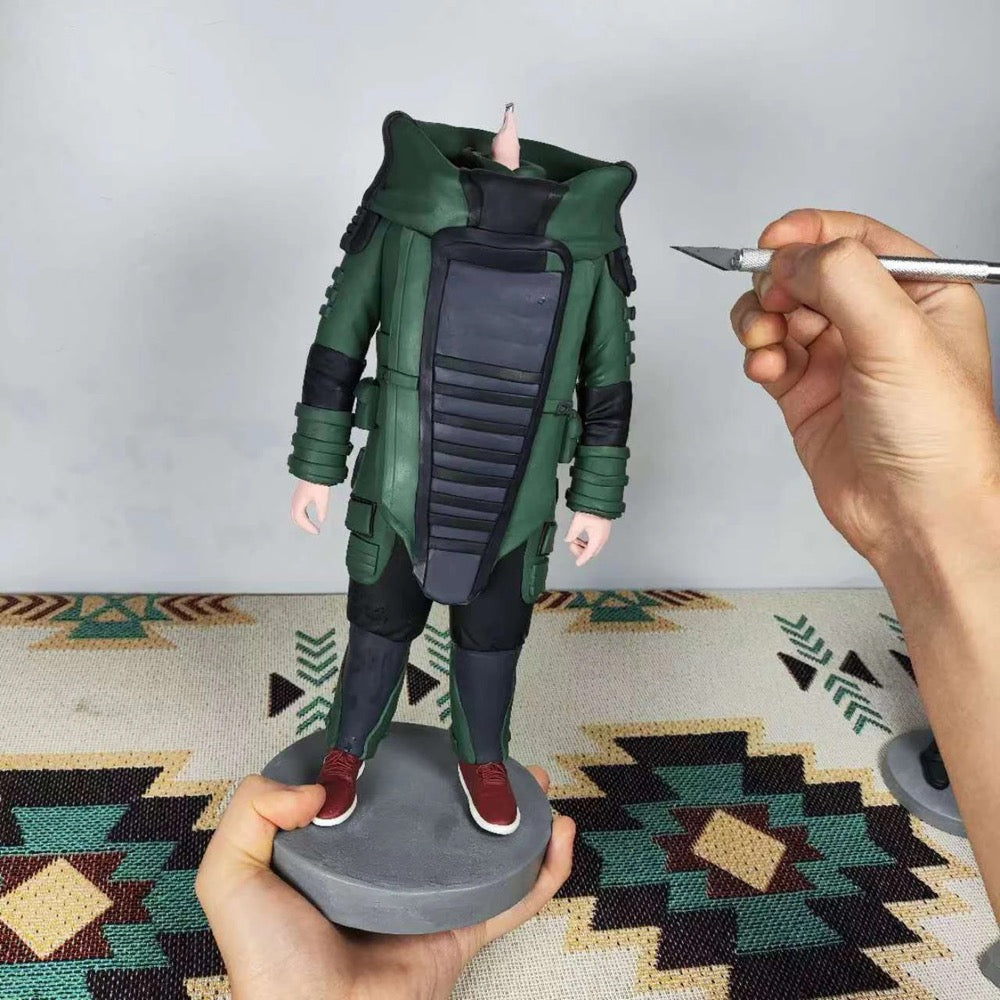 Handcrafted custom military bobblehead figure in progress, showcasing fine details and unique design elements.