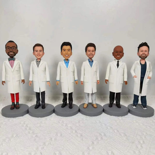 Group of custom doctor bobbleheads in white coats, personalized team figures for healthcare professionals.
