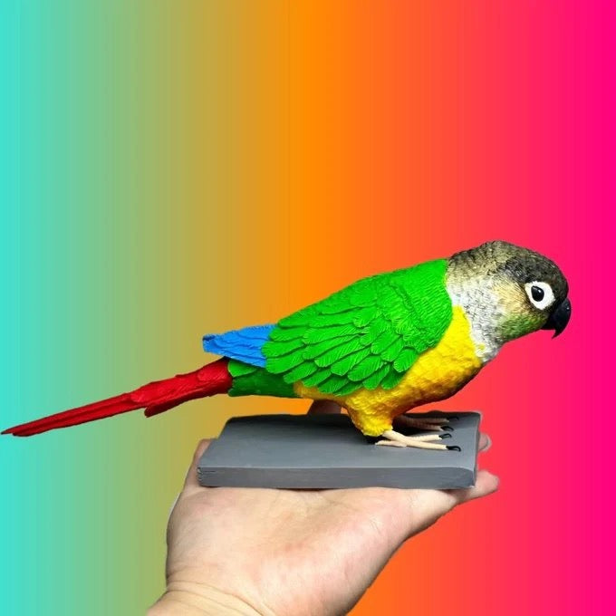 Colorful parrot perched on a hand against a rainbow gradient background