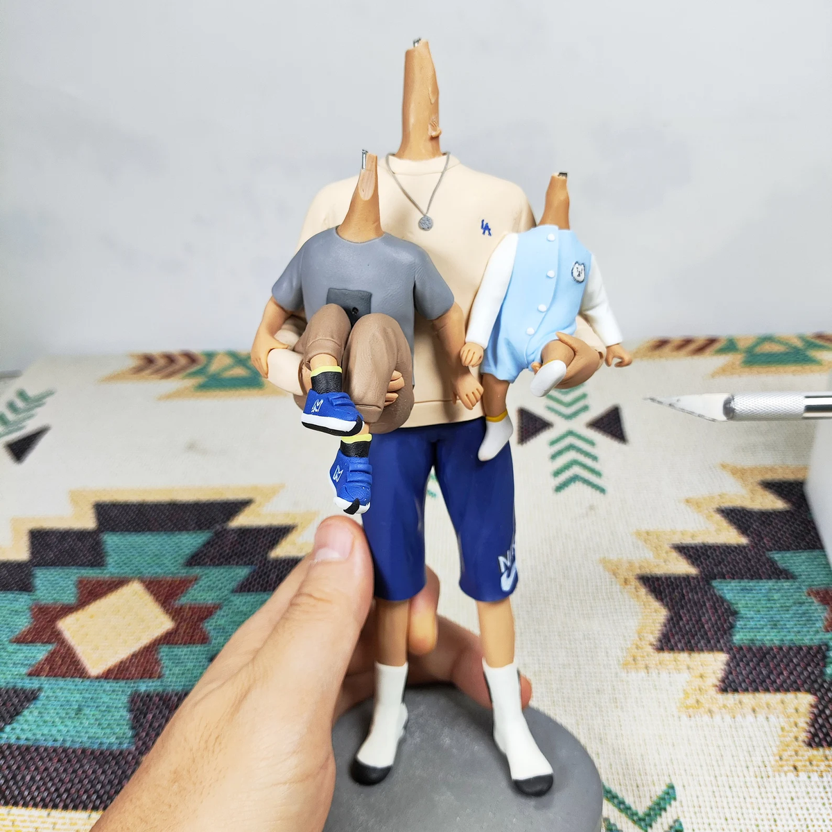 Handmade custom family portrait figure process showing outfit pose and body details