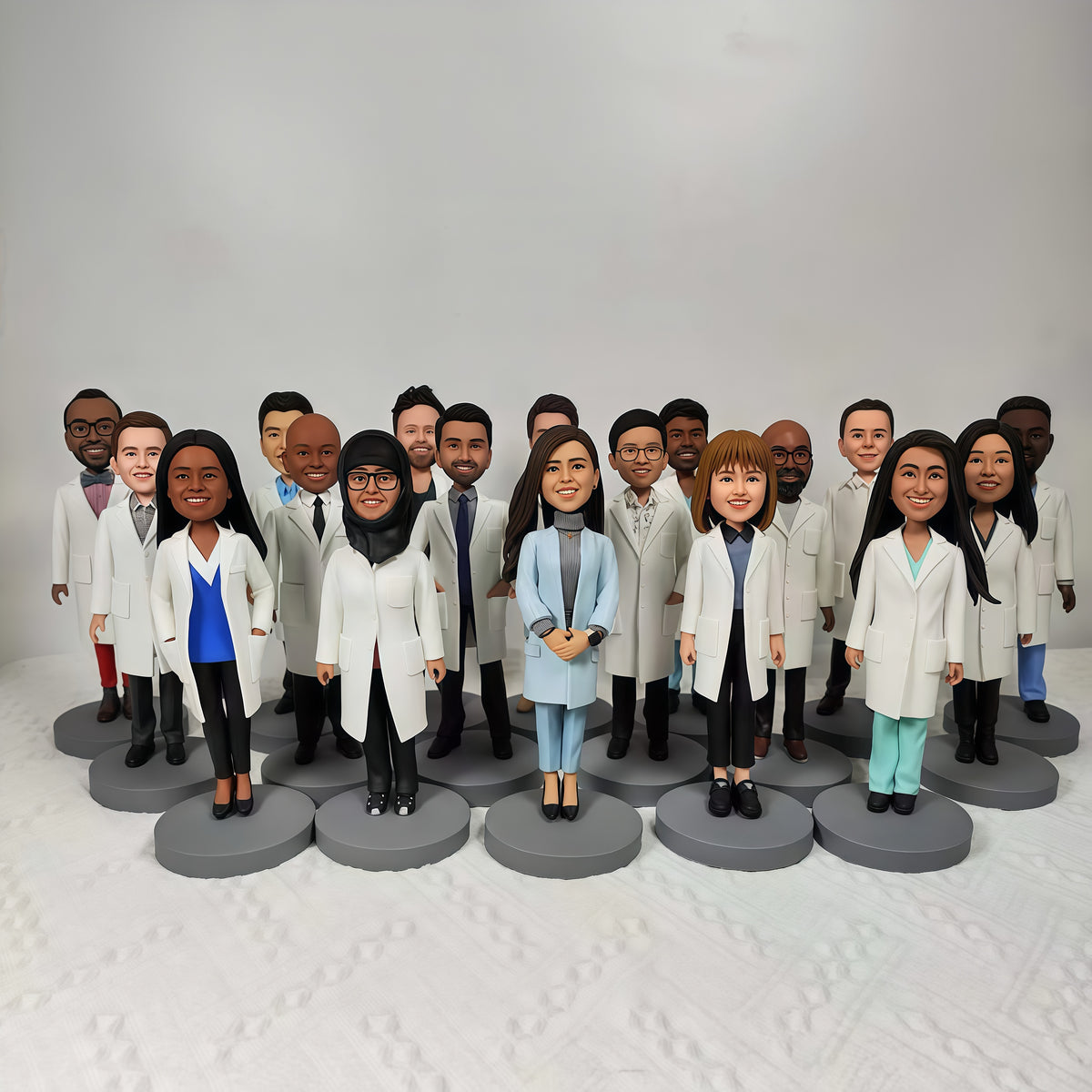 Custom group bobbleheads in uniforms as a personalized holiday gift for teams and coworkers