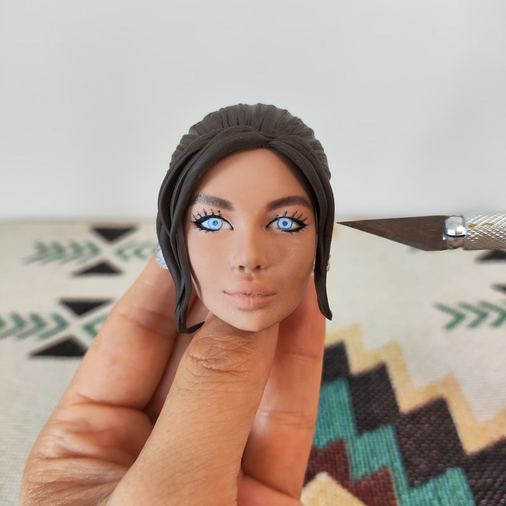 Handmade personalized couple figurine face details showing hairstyle and facial features